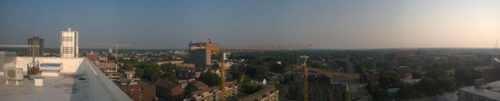 Panoramic view with three tower cranes in Champaign-Urbana