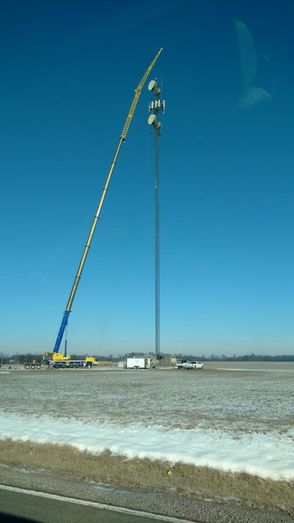 A 275 ton hydraulic crane works on a cell tower in DuBois, IL.