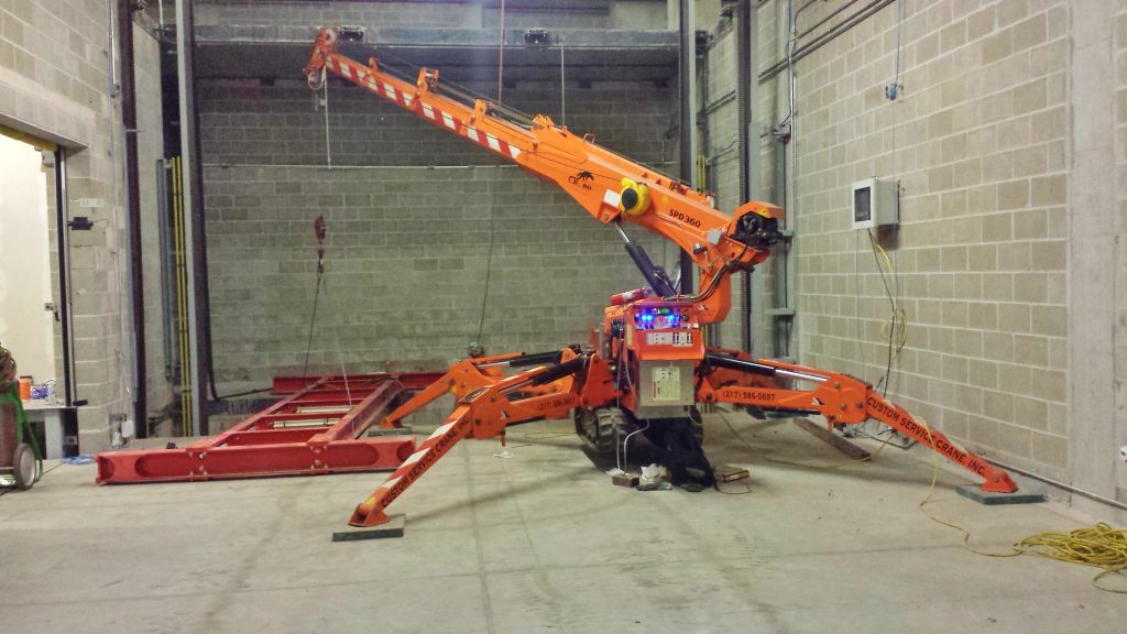 Jekko mini crane is installing an automated parking garage in Champaign, IL.